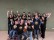 Foto: Das Sportfahrt-Team aus Rösrath 2025 bestand aus acht Schüler*innen, drei Lehrkräften, einer Physiotherapeutin und einem Schulbegleiter. Alle haben ihre neuen Sportcamp T-Shirts an!